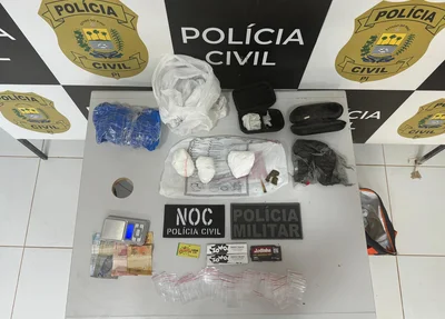 Material apreendido durante buscas na residência do alvo de prisão