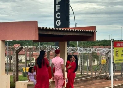 Oruam visita pai Marcinho VP vestido de rosa